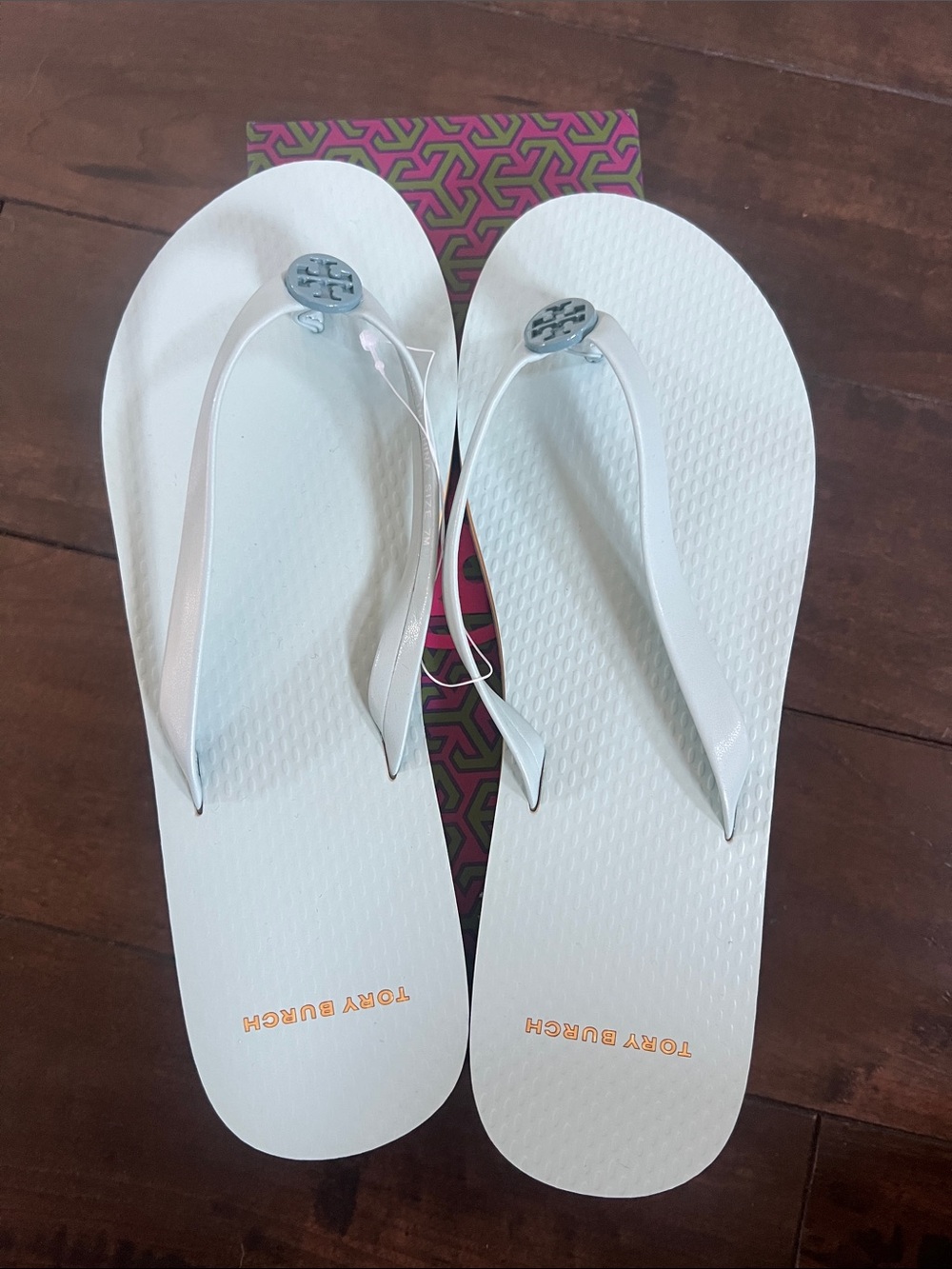 Tory Burch White Flip Flops with Silver Logo Medallions